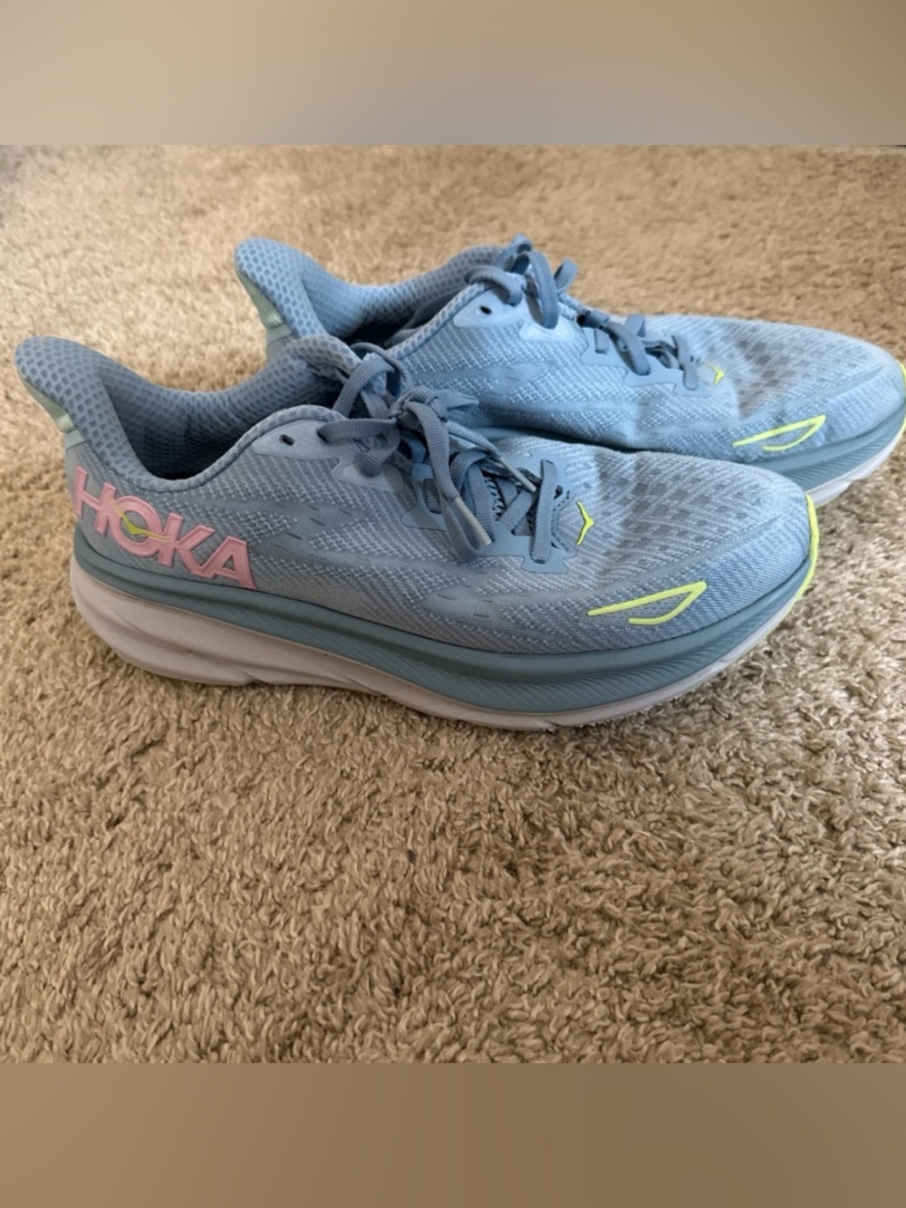 Hoka Light Blue Running Shoe with Neon Yellow Logo